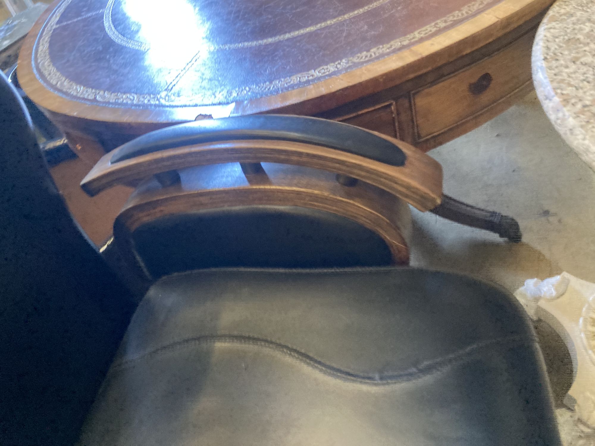 A black leatherette adjustable barbers chair, width 70cm, height 120cm